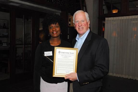Rep. Thompson presents a certificate of Congressional recognition to Dr. Renfro.