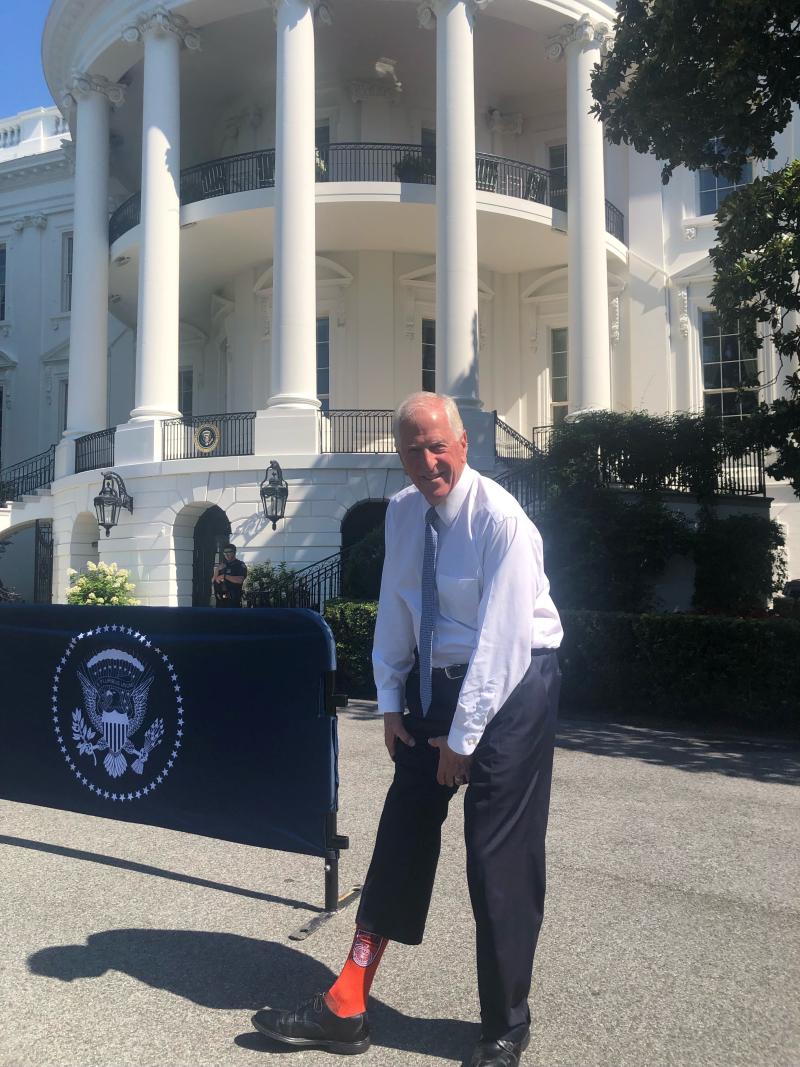 Mike at White House showing sock with GunPrevention logo