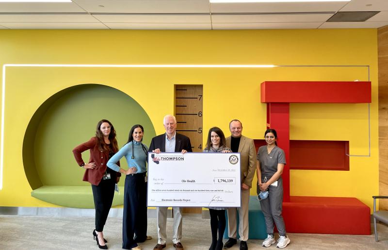 Mike presenting check to OLE Health